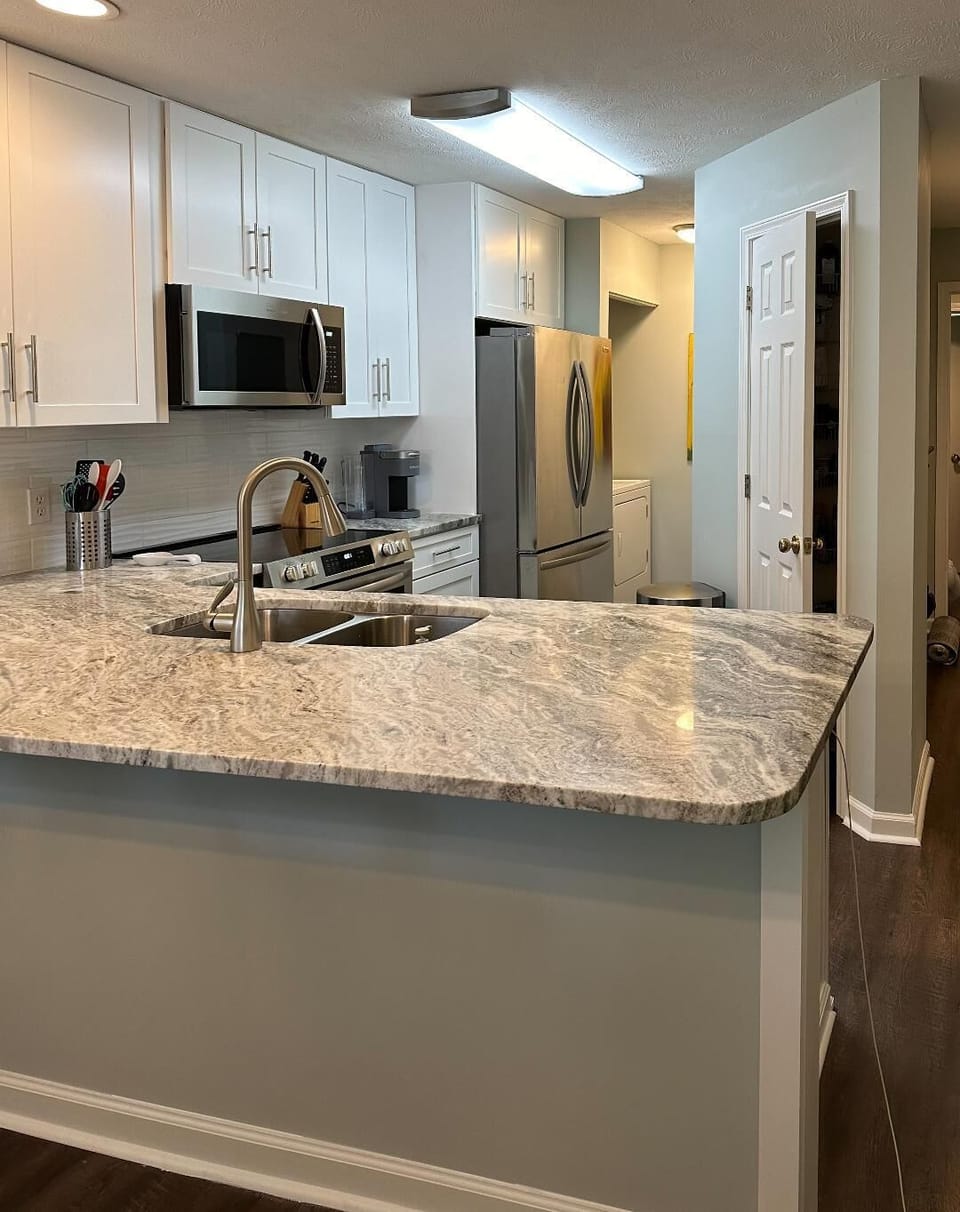 BRAND NEW renovated kitchen with stainless steel appliances & marble countertops