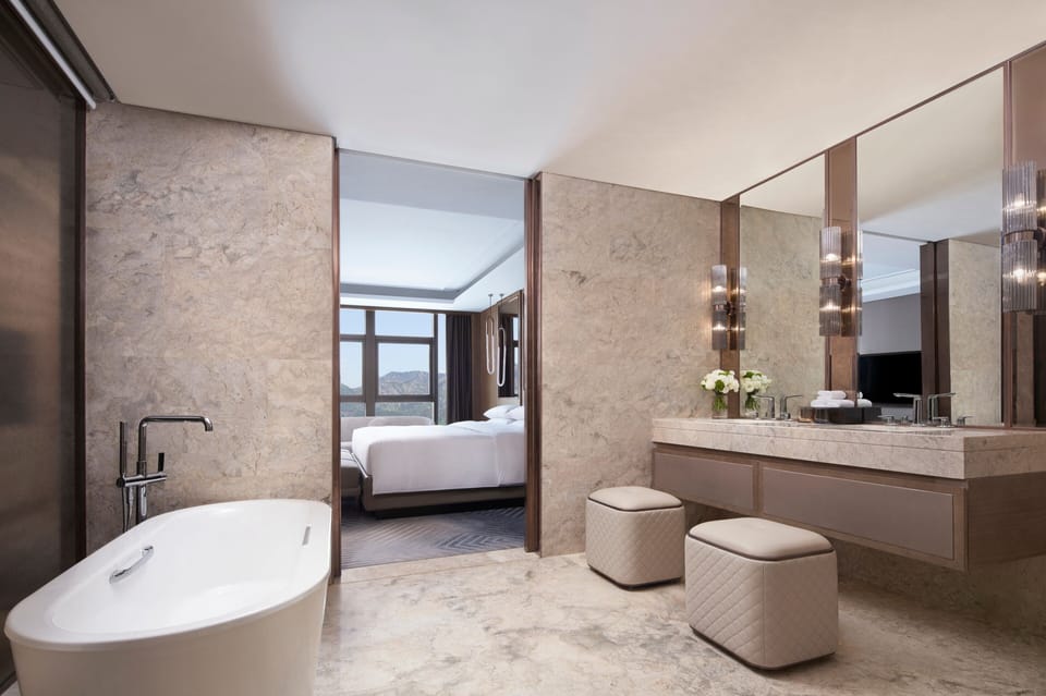 Club Suite, 1 Bedroom, River View | Bathroom | Separate tub and shower, rainfall showerhead, designer toiletries
