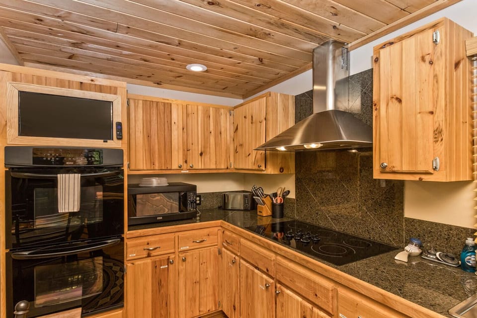 Double oven, microwave, large vent hood are just a few of the kitchen amenities that you can enjoy while preparing meals.