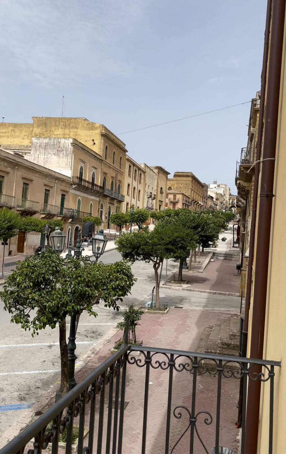 Balcony view looking up the road.  Multiple restaurants within walking distance.