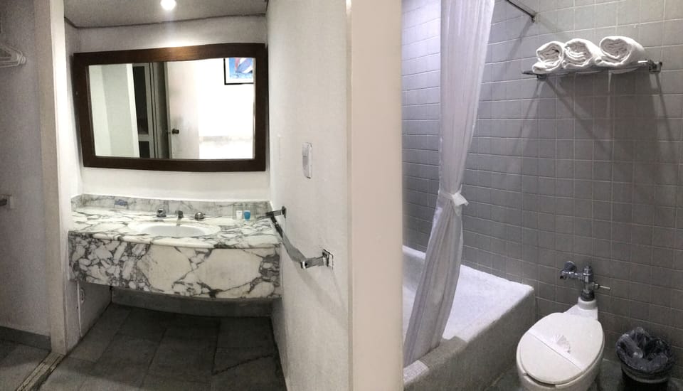 Shower, rainfall showerhead, eco-friendly toiletries, towels