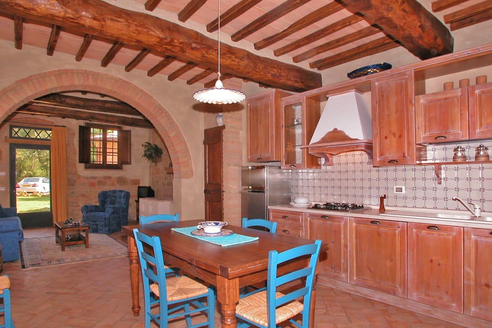 The main living-dinner room with the kitchen in the bigger unit