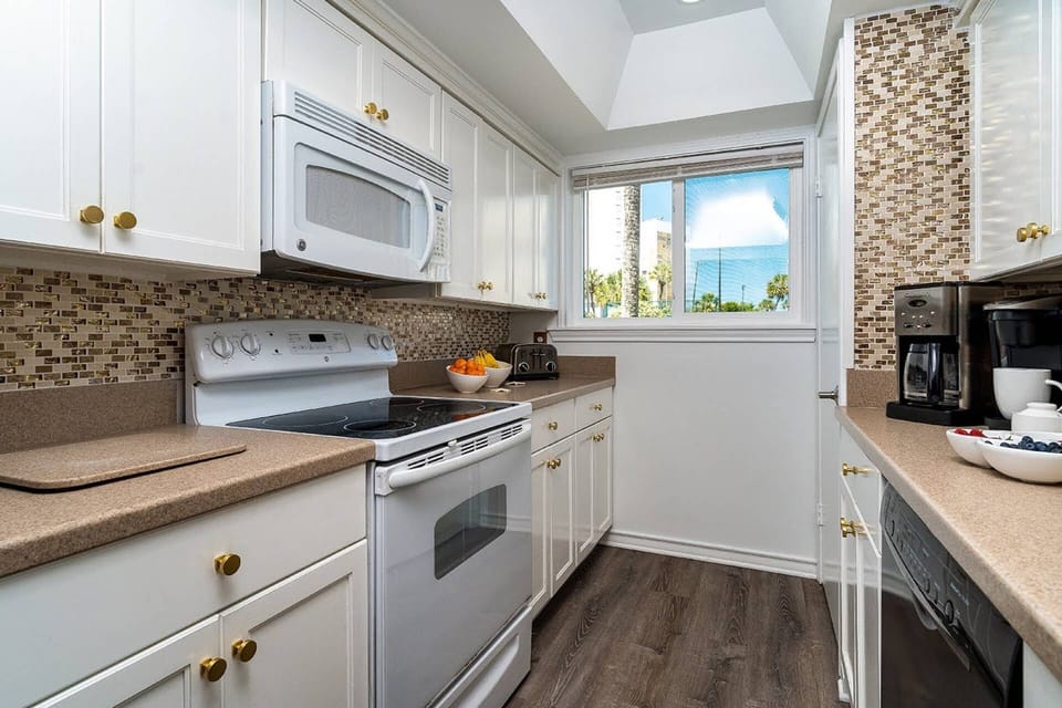 Inviting Kitchen with Stainless Steel Refrigerator, Electric Stovetop & Oven, Microwave & Dishwasher