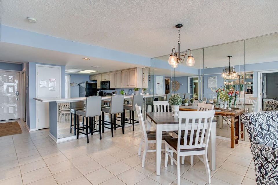 Open kitchen and living area with Gulf views at Wind Drift Orange Beach