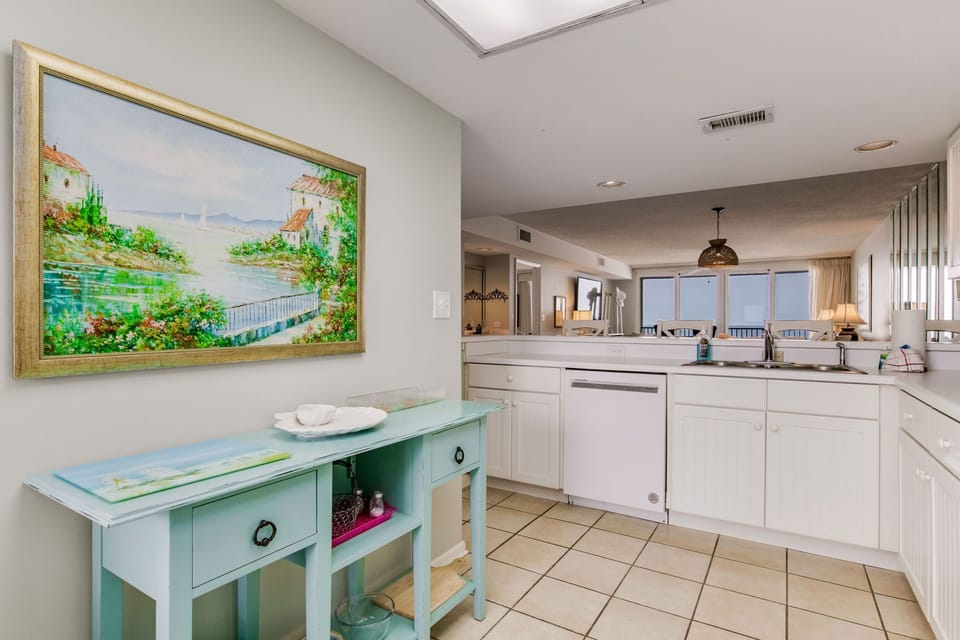 Kitchen with modern appliances at Wind Drift Orange Beach top-floor unit