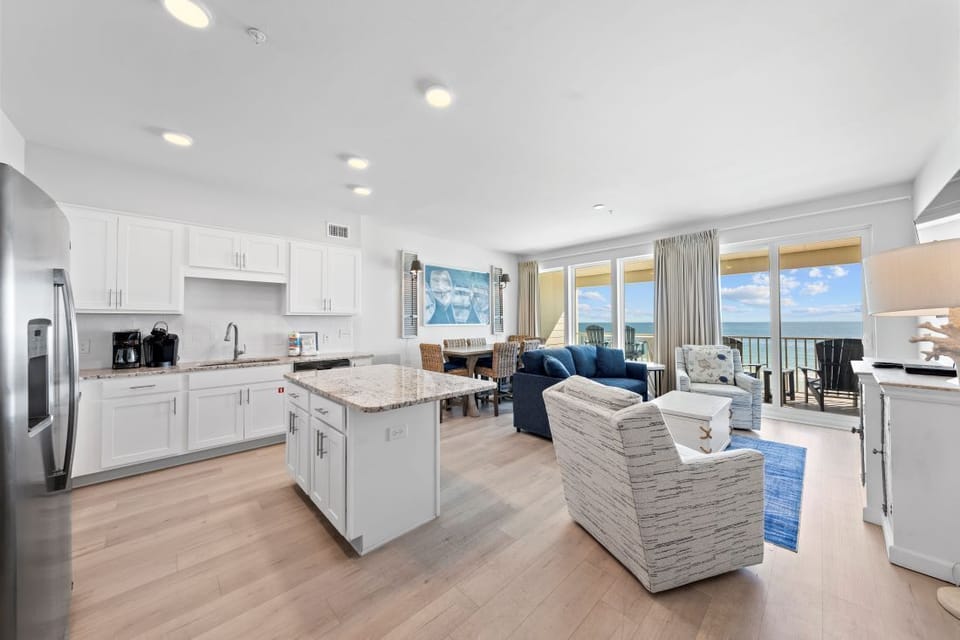 Your stunning oceanfront retreat features an open-concept space where you'll cook, dine, and relax while soaking in breathtaking sea views through floor-to-ceiling windows.
