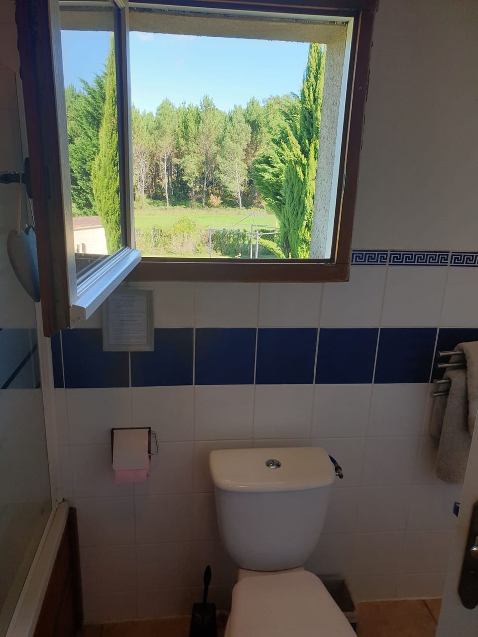 Second bathroom with bath and shower overhead. 