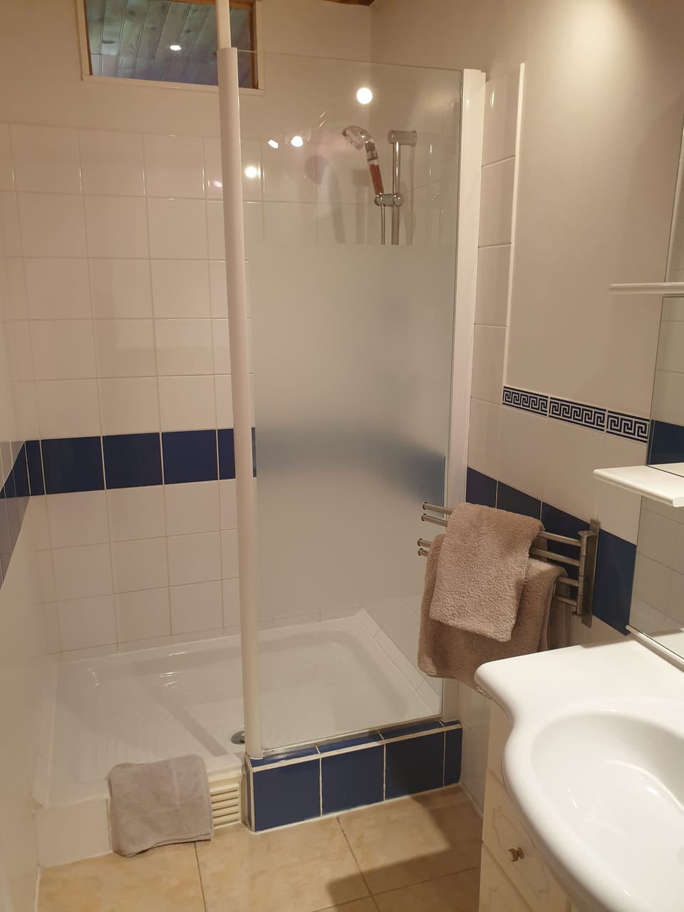 En-suite shower room with sink and toilet
