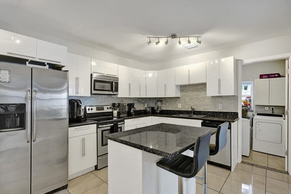 Full size kitchen with a laundry room