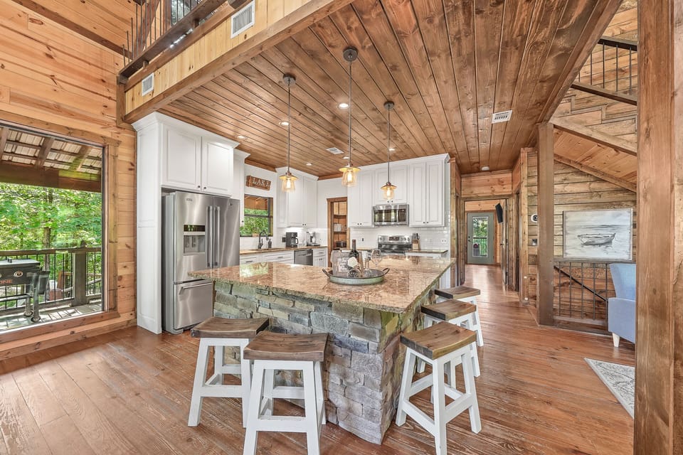 Granite countertops, custom cabinets, and stainless appliances make this kitchen feel both stylish and functional.
