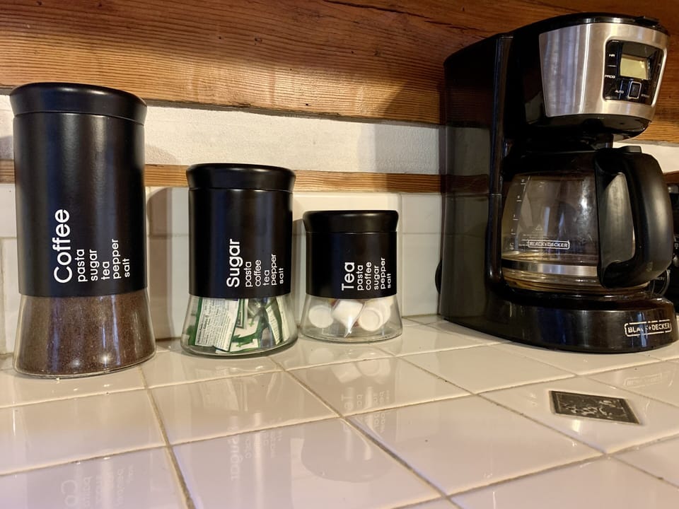 Coffee, creamer and sugar are provided.