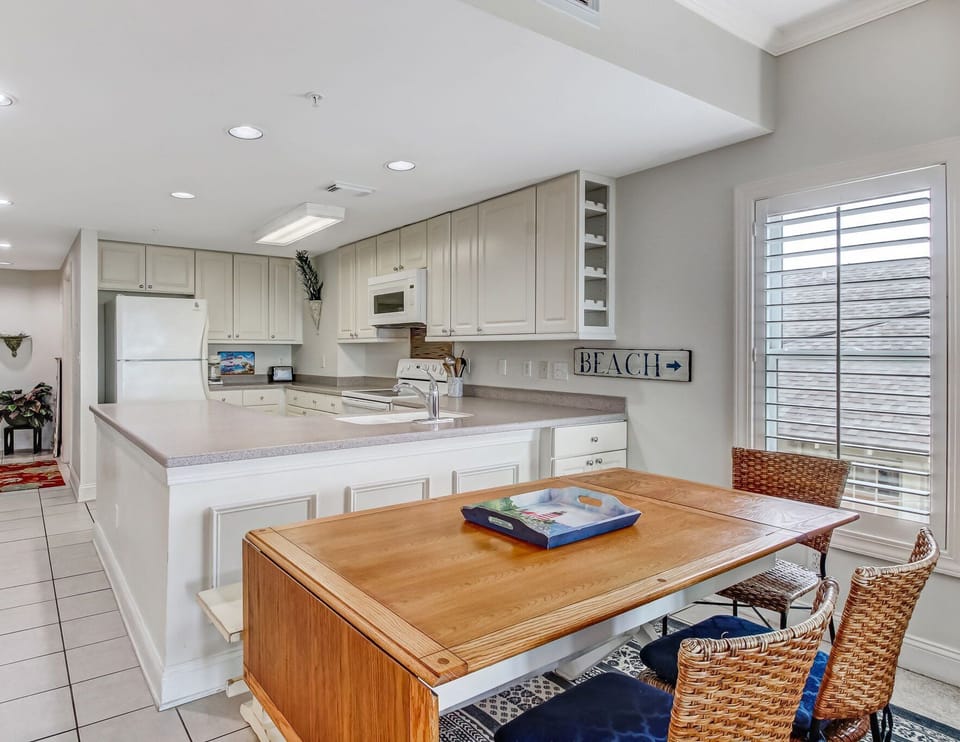 Dining table has plenty of seating for the group with a leaf that can be folded up for extra table space.