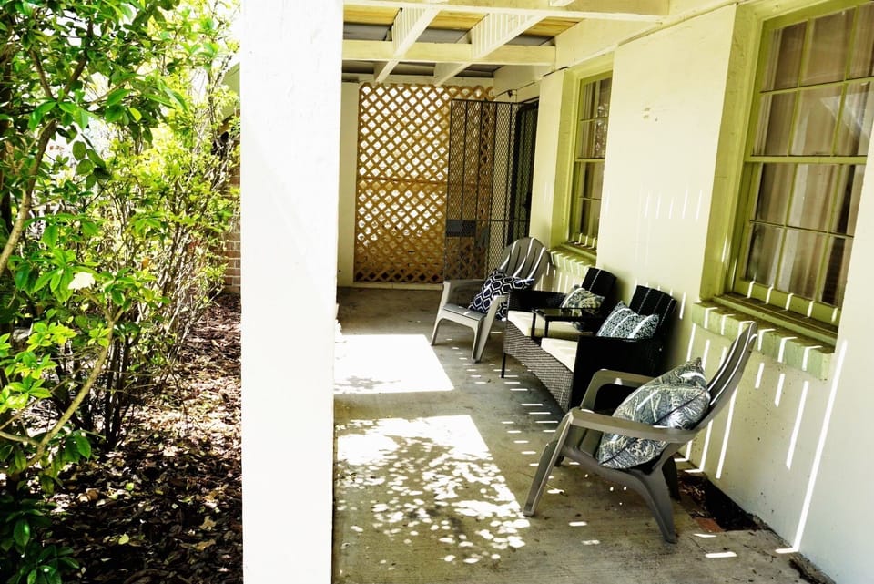 There are multiple seating areas throughout the covered terrace.
