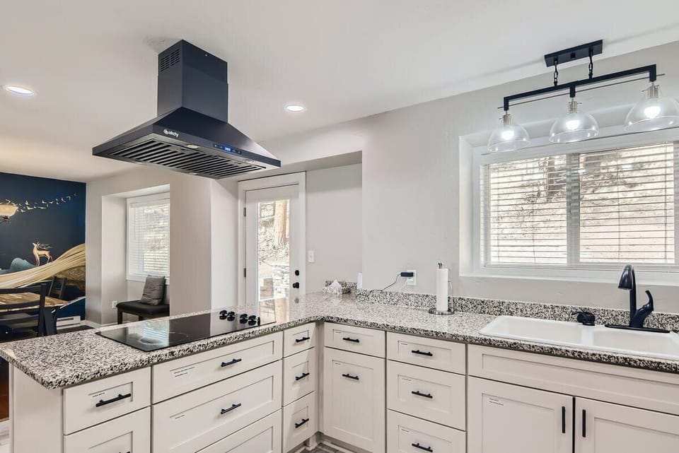 Kitchen with view of backyard suite