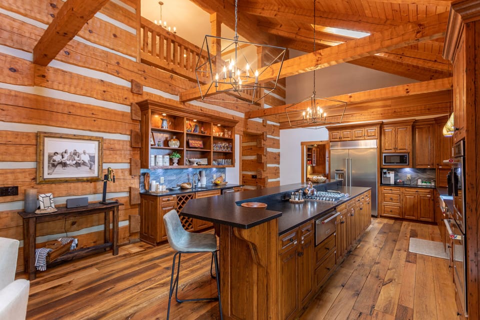 Fully stocked kitchen with formal dining area and kitchen bar.