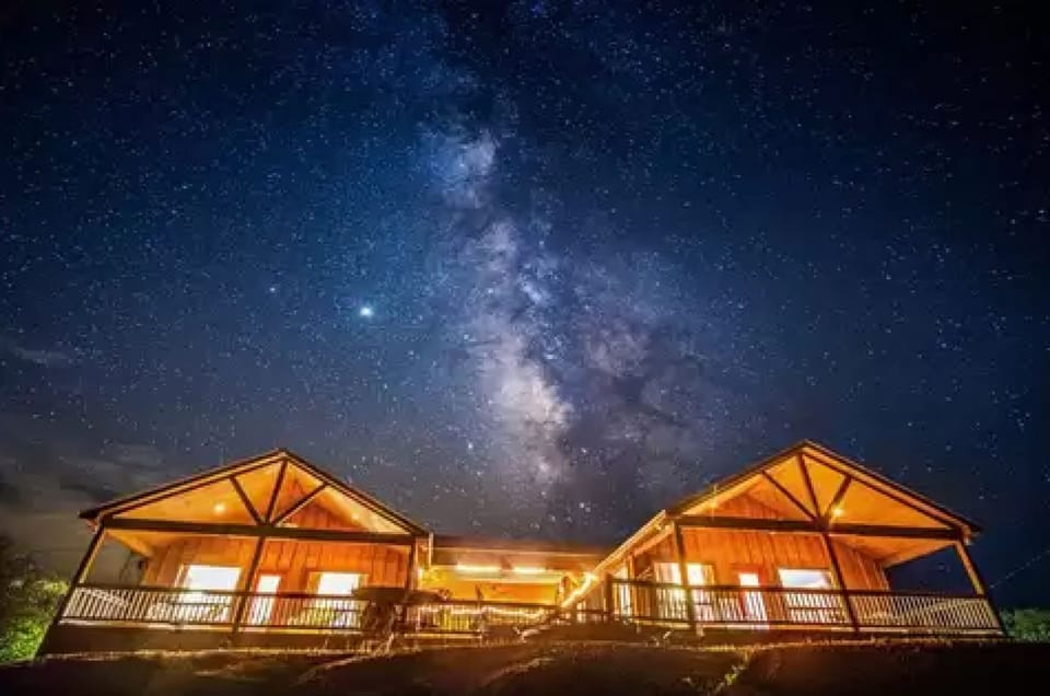 Cabins C + D @ night under the Milky Way! Area voted for the best stargazing! 