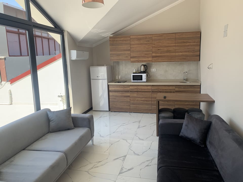 Dubleks  Suite | Living area | TV