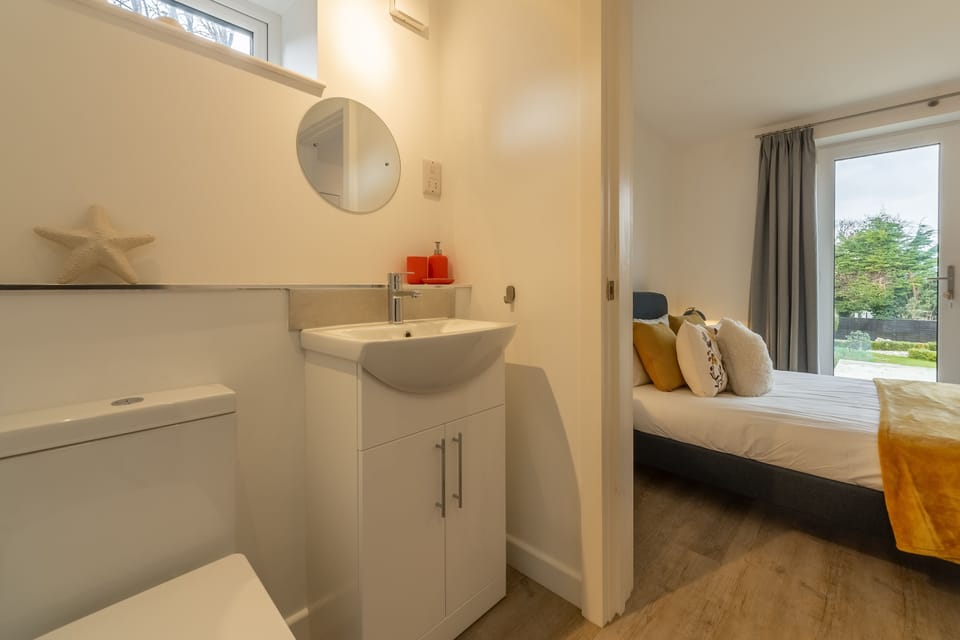 Ground floor: En-suite to bedroom two with shower, WC and wash basin