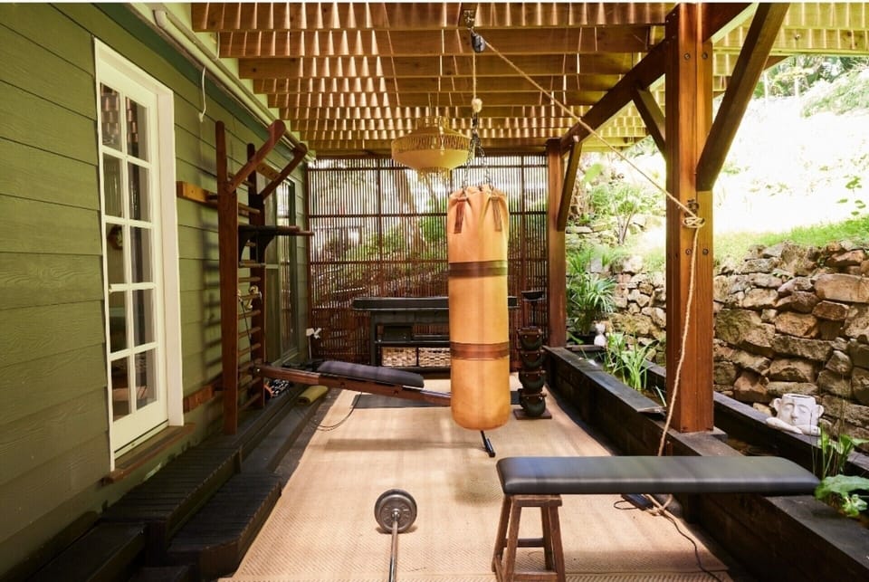 Balinese inspired gym / yoga space with NoHRD gym equipment & vintage boxing bag