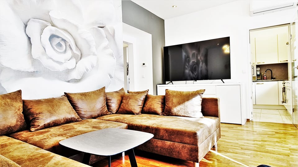 Luxury Apartment | Living area | 75-inch Smart TV with satellite channels, TV, Netflix