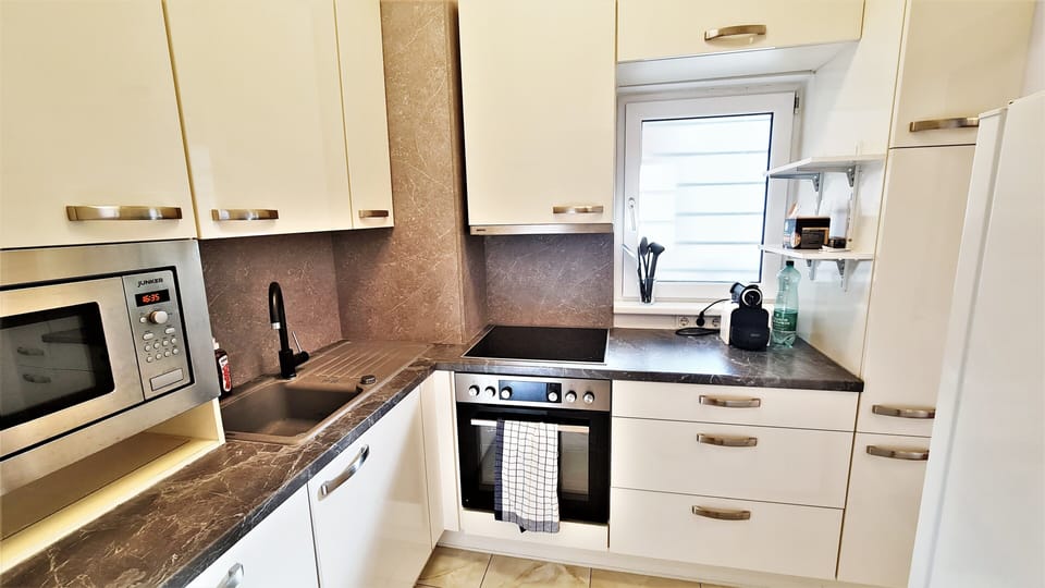 Luxury Apartment | Private kitchen | Full-size fridge, microwave, oven, stovetop