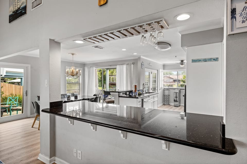 Bright, open kitchen at Lakeview Landing — black granite countertops and white cabinets make this space as beautiful as it is functional.