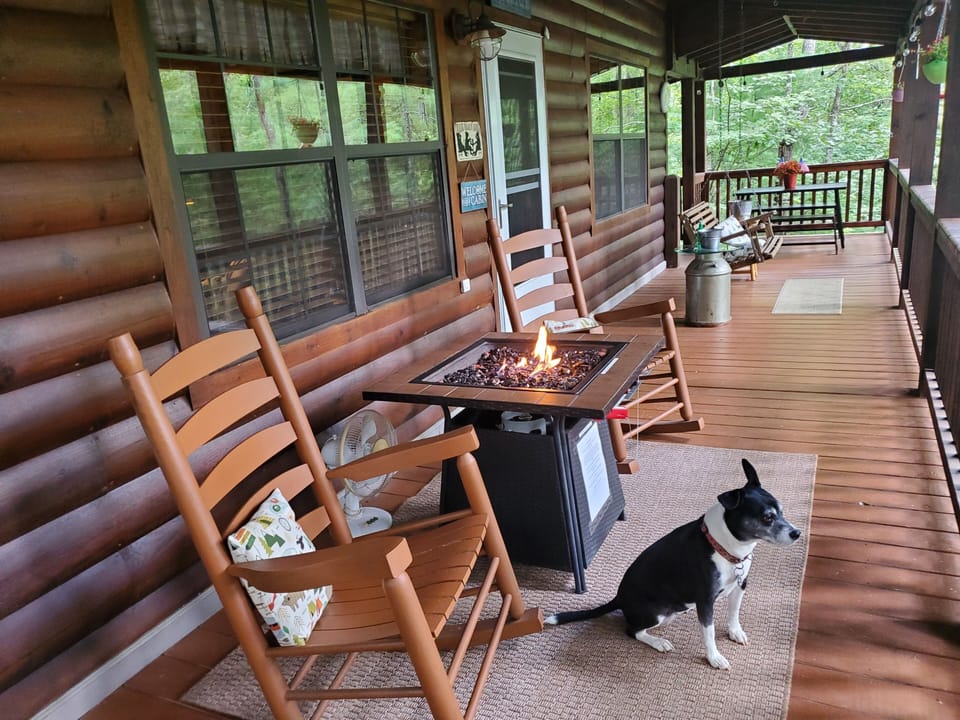 The 2 rocking chairs and the porch swing for 2 for  relaxing anytime of the day.