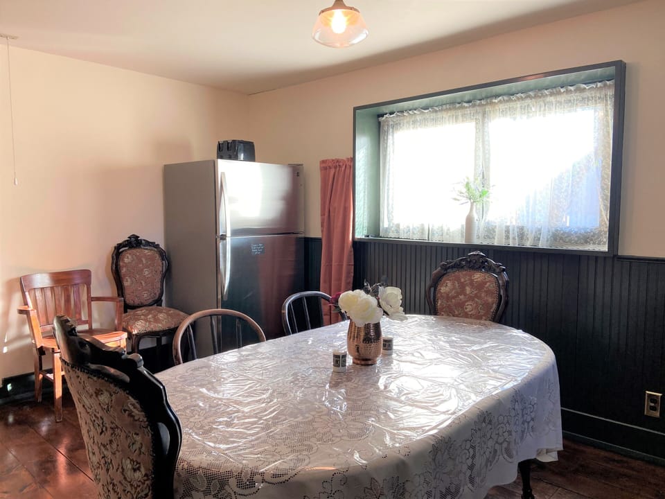 refrigerator and toaster. Extra chairs