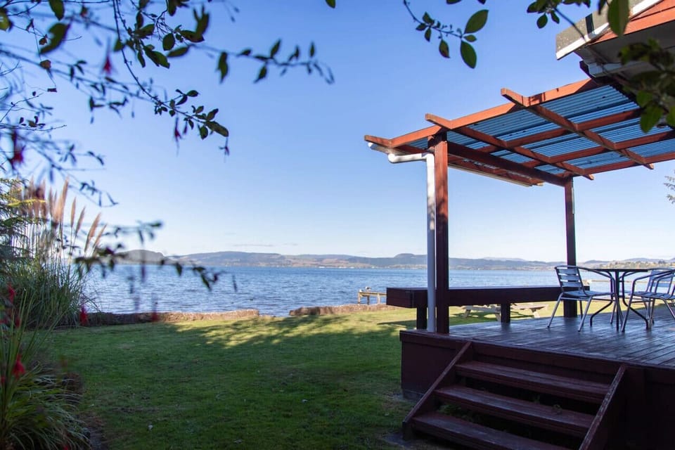 Covered deck on the lakefront lawn