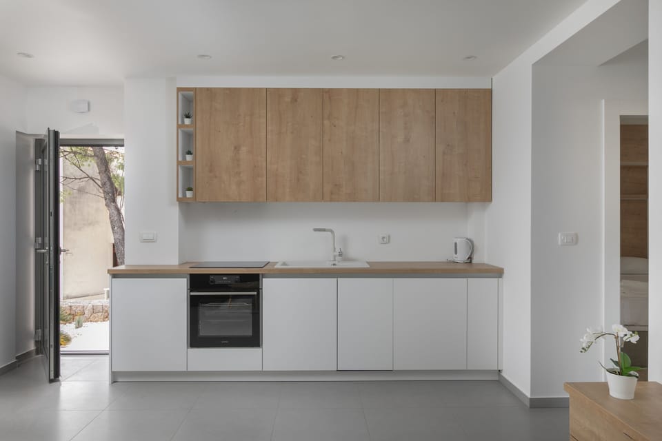 Comfort Apartment | Private kitchen | Full-size fridge, espresso maker, paper towels