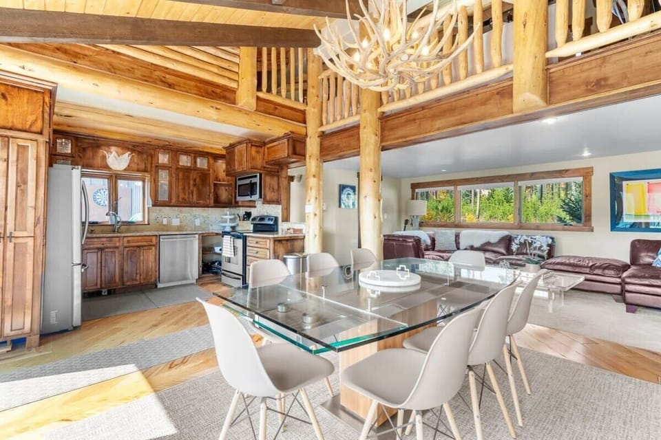 View of the family room, fully-equipped gourmet kitchen, and dining area
