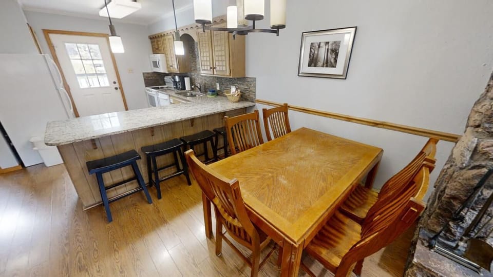 Gather around your dining table or perch at the kitchen island—this open space invites you to cook, share meals, and connect in a welcoming, light-filled setting.