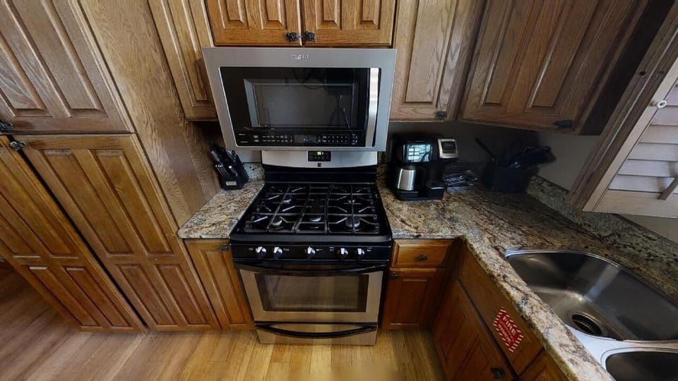 Your fully equipped kitchen features granite countertops, a gas stove, and modern appliances—perfect for preparing home-cooked meals during your stay.