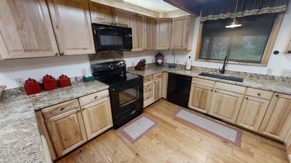 Cook your favorite meals in this fully equipped kitchen, with modern appliances, granite countertops, and plenty of space to gather and enjoy each other's company.