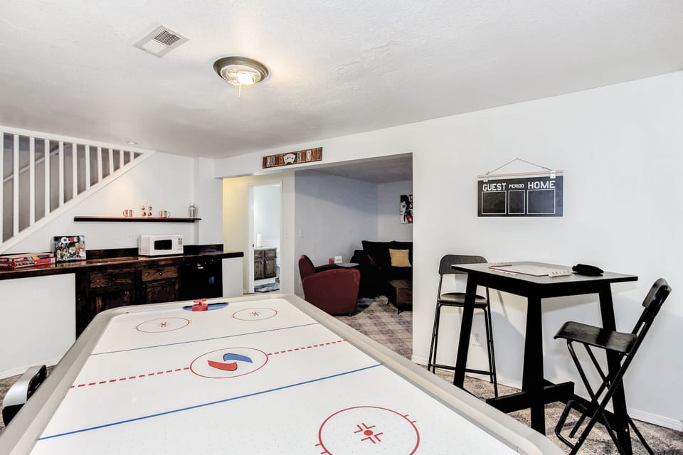 Bar area with pub table and air hockey table 