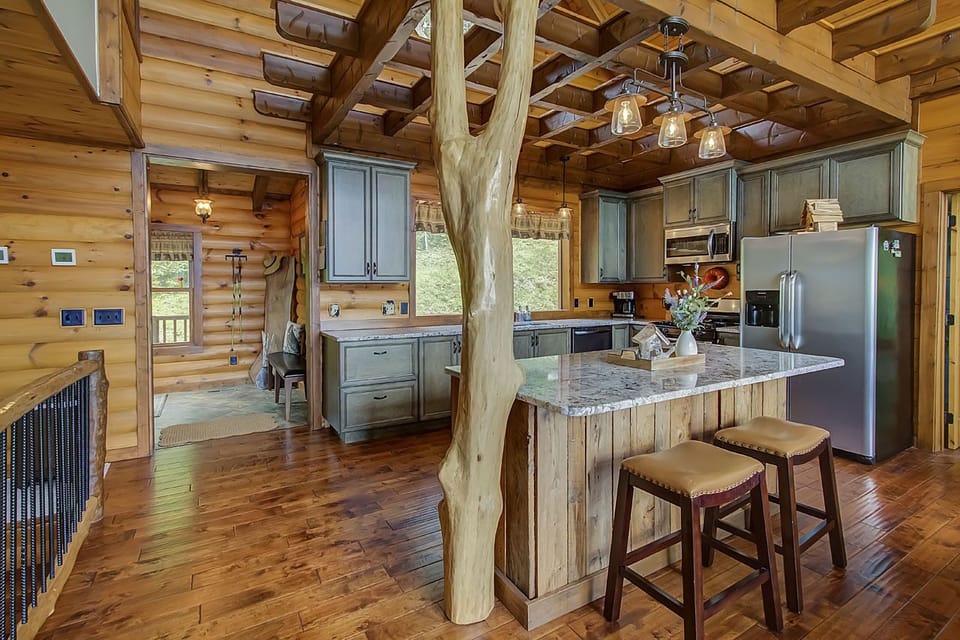 Gather with your family to cook wonderful meals in this open concept kitchen with granite countertops