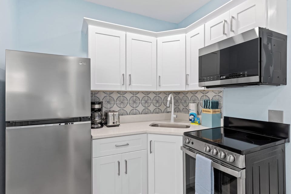 Creole Garden Cottage at The Palmview Inn features a king bed, queen sleeper sofa with memory foam mattress, kitchen, and bathroom with walk in shower and is newly completed with brand new furniture and appliances