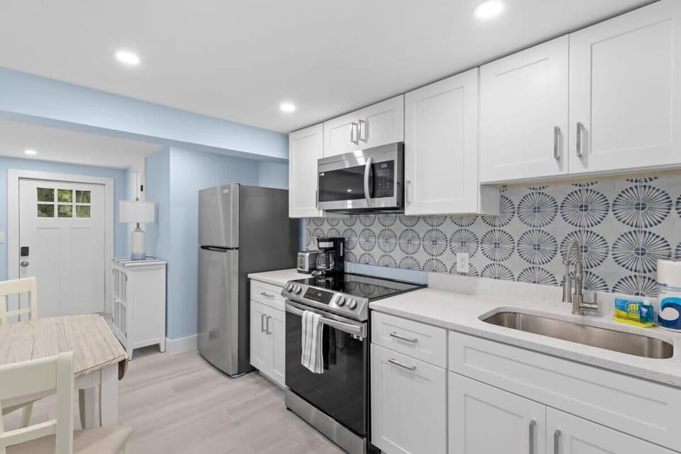 Full kitchen featuring small and large appliances
