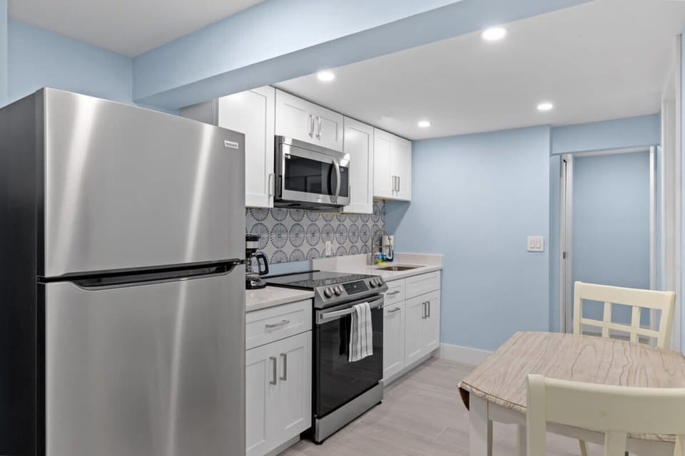 Full kitchen featuring small and large appliances
