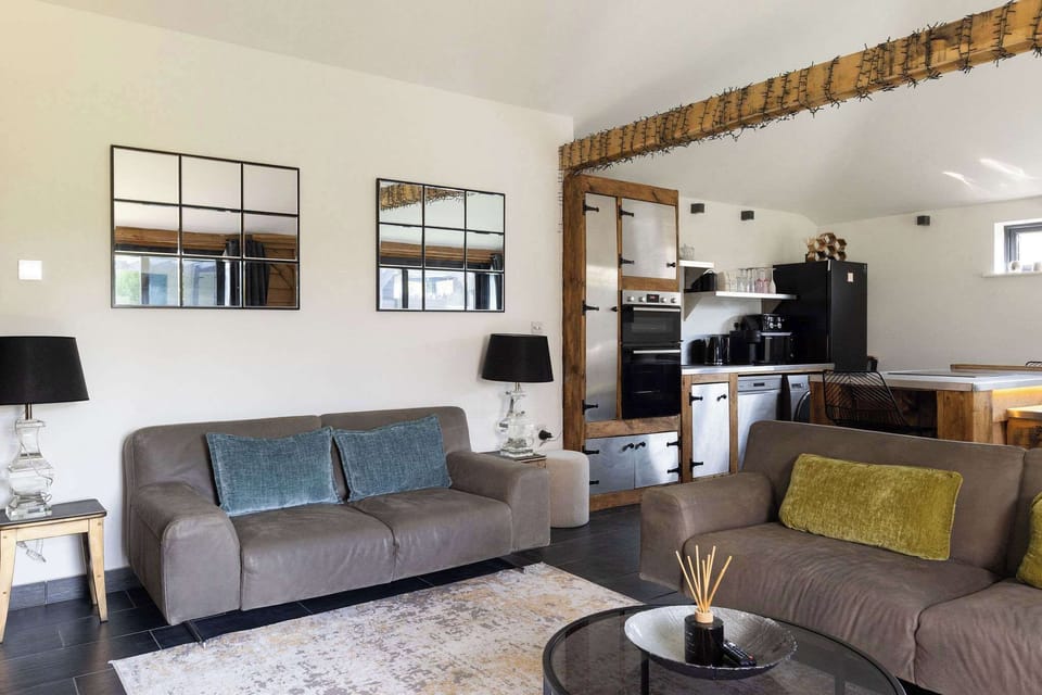 Relax in this spacious, stylish open-plan living area with unique modern-industrial design.