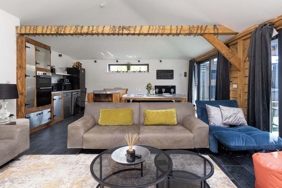 Unwind in a beautifully designed open-plan living area perfect for relaxing and cozy evenings in.