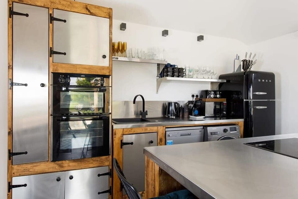 The kitchen has everything you need to cook up a storm, including a double oven, dishwasher and fridge freezer.