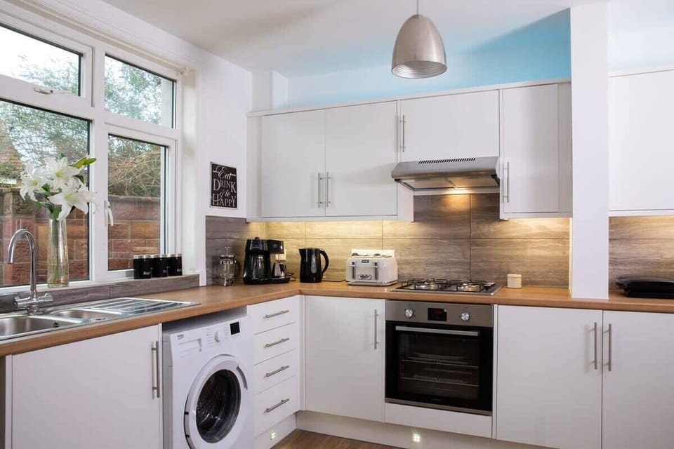 The house has a smart, modern kitchen.