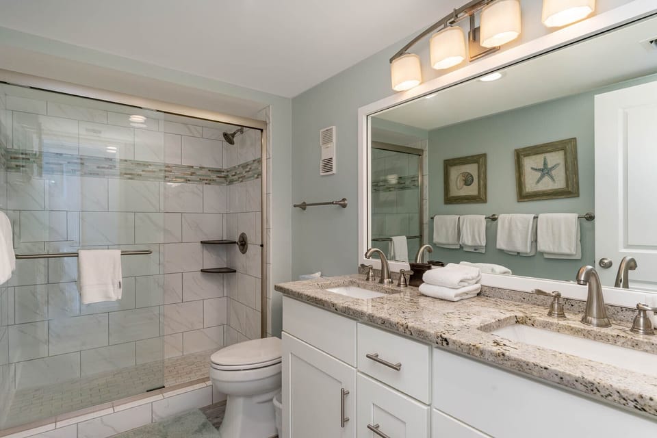 Master Ensuite - Remodeled ensuite with tiled walk-in shower and double vanity.