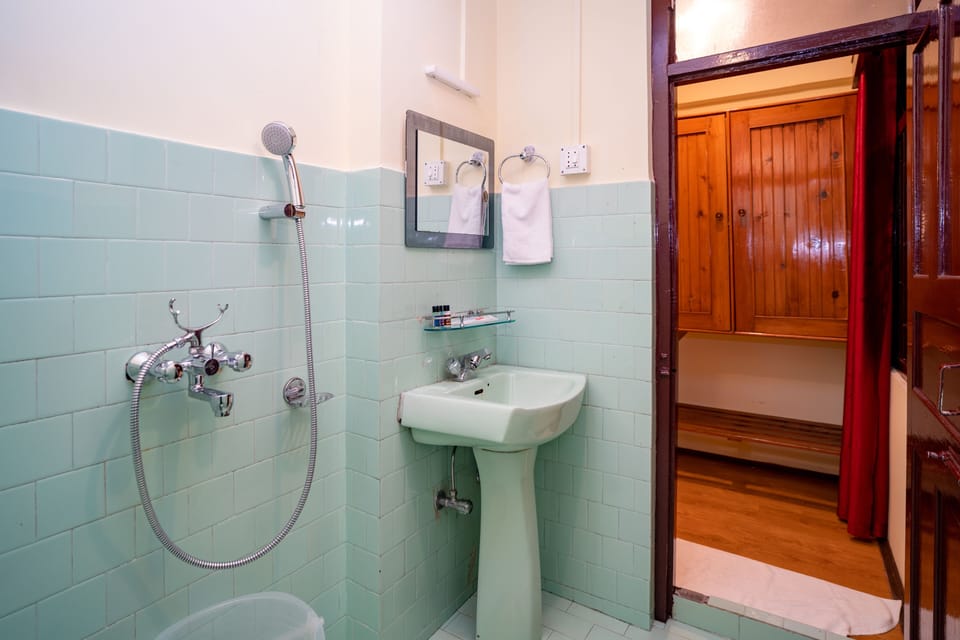 Shower, free toiletries, slippers, towels