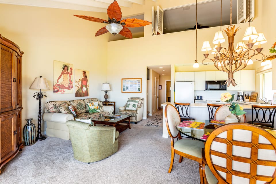 Relax in your bright, tropical-themed living space with high ceilings, island-inspired décor, and an open layout connecting to your fully equipped kitchen and dining area.