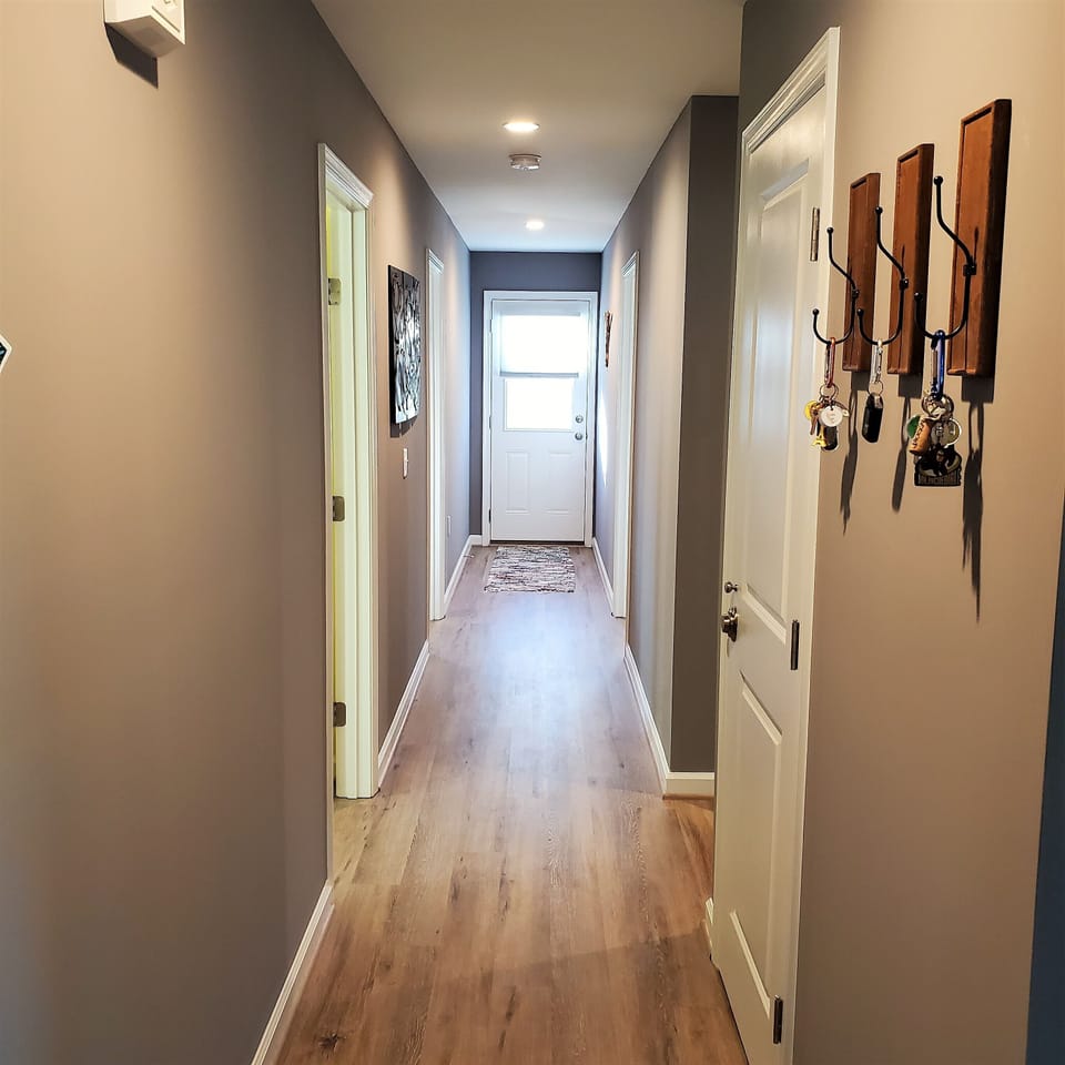 Several hooks and mirrors. Large closet spaces. Back door to deck.