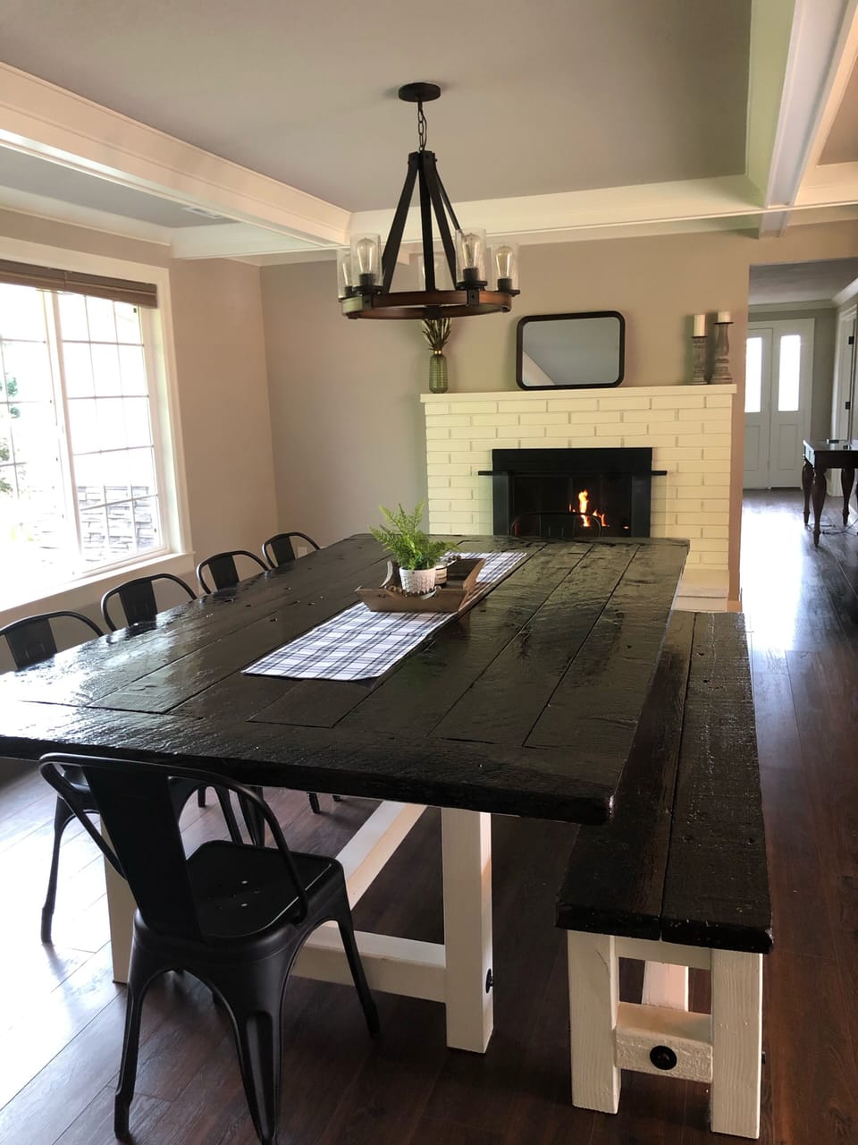 Oversized dining table with gas fireplace creates a beautiful ambiance. 
