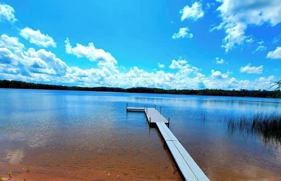 A long dock on Bony Lake with sandy bottom