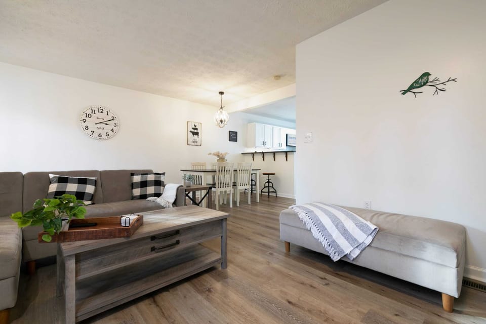 An inviting living room with comfortable seating and a comfy couch.